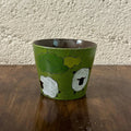 Handmade ceramic mug with sheep and clouds design, green glaze, food-safe tableware