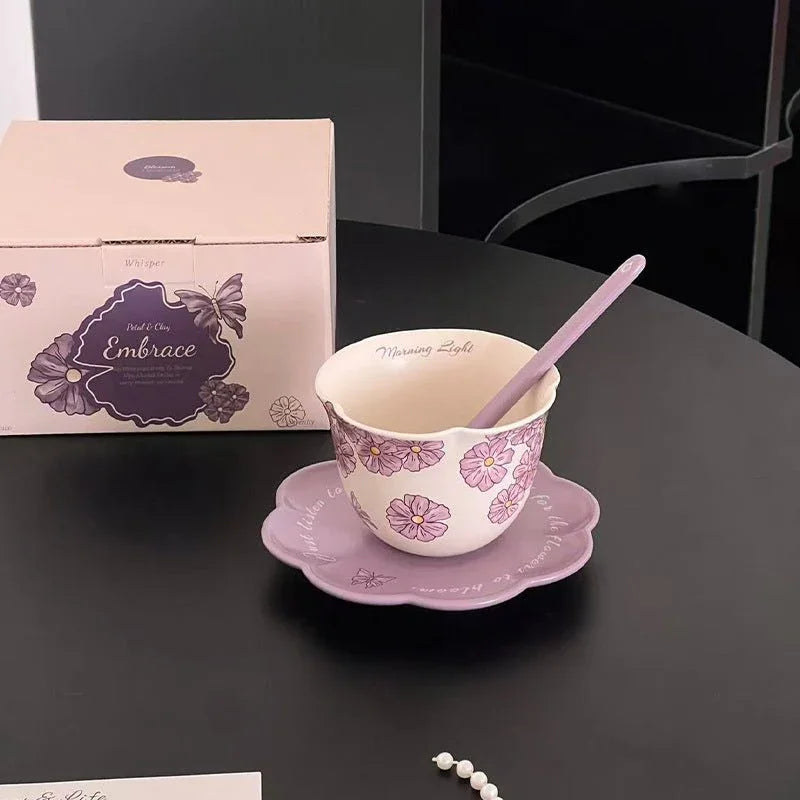 Purple floral ceramic mug with matching saucer and spoon, 'Morning Light' text, gift box labeled 'Embrace'